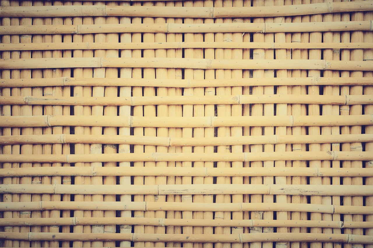 Close-up shot of a traditional woven bamboo wall showcasing detailed texture and pattern.